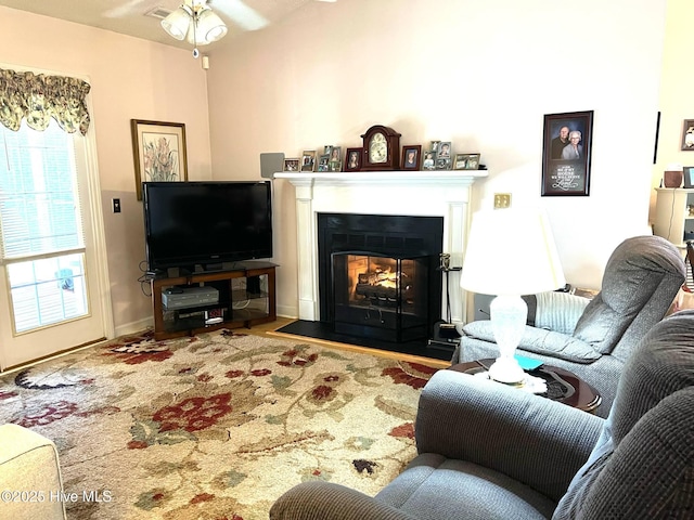 5707 Mossberg Ct, Wilmington, NC 28405 - living area with a glass covered fireplace and a ceiling fan