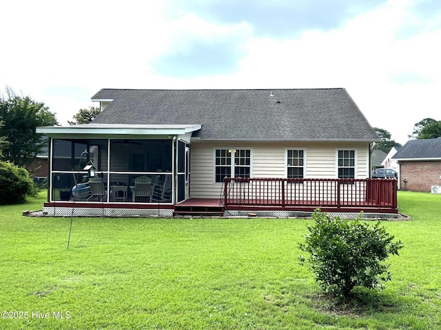5707 Mossberg Ct, Wilmington, NC 28405 - rear view of property featuring a sunroom, a wooden deck, a lawn, and a shingled roof