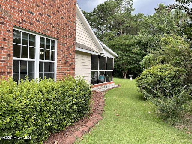 5707 Mossberg Ct, Wilmington, NC 28405 - view of green lawn with a sunroom
