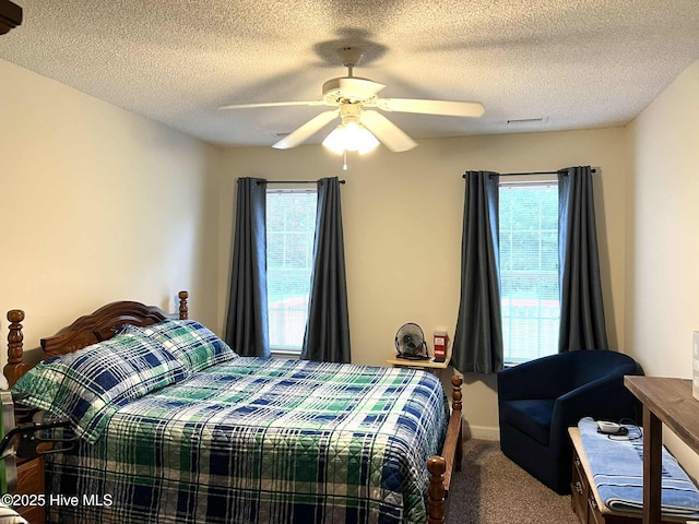 5707 Mossberg Ct, Wilmington, NC 28405 - carpeted bedroom with a ceiling fan and a textured ceiling