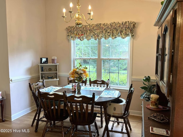 5707 Mossberg Ct, Wilmington, NC 28405 - dining room featuring a chandelier, plenty of natural light, and light wood finished floors