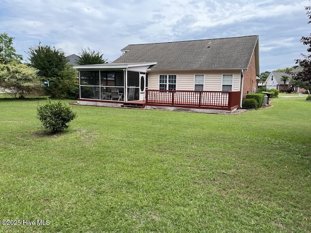 5707 Mossberg Ct, Wilmington, NC 28405 - back of property featuring a sunroom, a yard, a deck, and roof with shingles