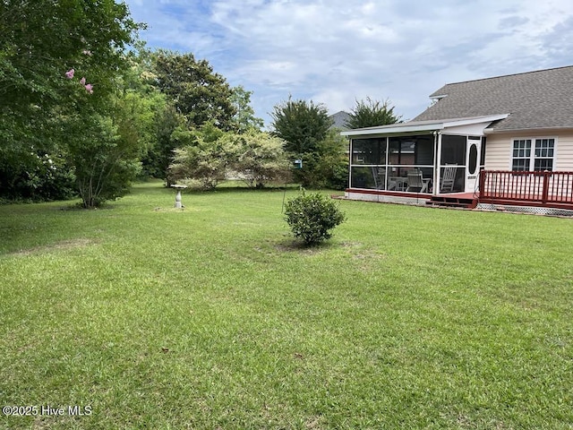 5707 Mossberg Ct, Wilmington, NC 28405 - view of green lawn with a sunroom and a wooden deck