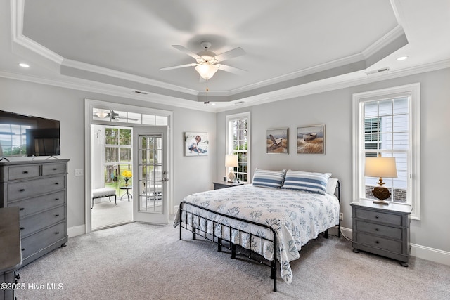3059 Irwin Dr SE, Southport, NC 28461 - bedroom featuring a tray ceiling, access to exterior, carpet flooring, ornamental molding, and baseboards