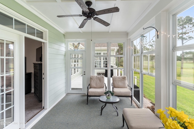 3059 Irwin Dr SE, Southport, NC 28461 - sunroom featuring ceiling fan, carpet flooring, and crown molding
