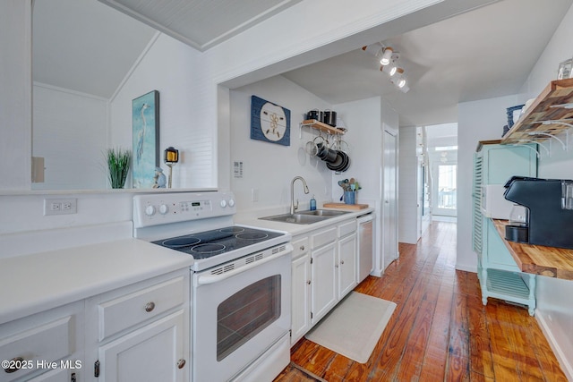 1904 Ocean Blvd, Topsail Beach, NC 28445 - kitchen with white appliances, a sink, white cabinets, wood-type flooring, and light countertops