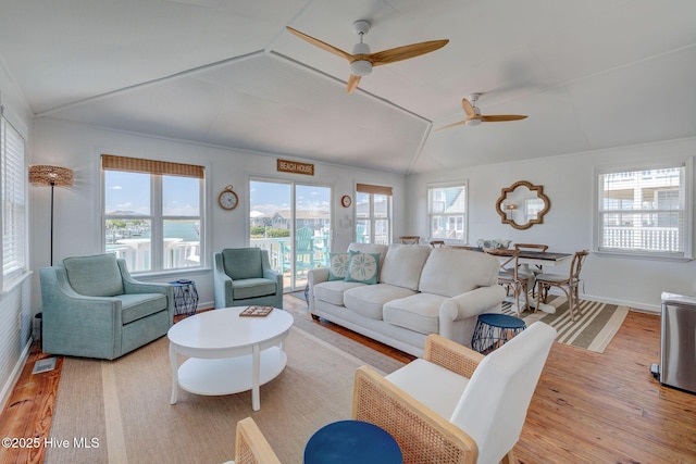 1904 Ocean Blvd, Topsail Beach, NC 28445 - living area with light wood-style flooring, vaulted ceiling, a ceiling fan, and baseboards