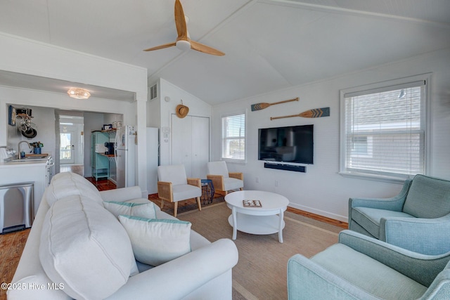 1904 Ocean Blvd, Topsail Beach, NC 28445 - living area featuring light wood-style flooring, a ceiling fan, lofted ceiling, and baseboards