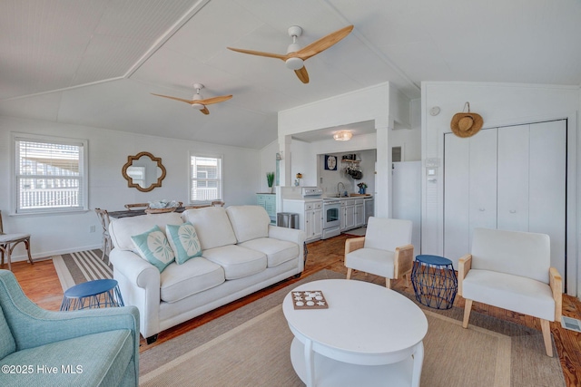 1904 Ocean Blvd, Topsail Beach, NC 28445 - living room with lofted ceiling, ceiling fan, and light wood-style floors