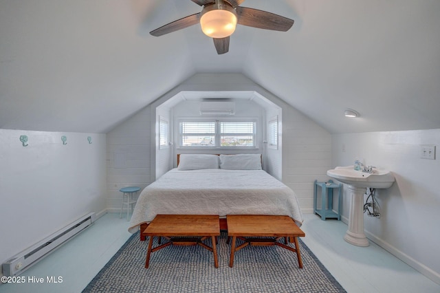 1904 Ocean Blvd, Topsail Beach, NC 28445 - bedroom with a baseboard radiator, a wall mounted AC, a ceiling fan, and vaulted ceiling