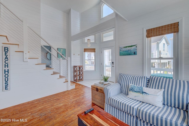 1904 Ocean Blvd, Topsail Beach, NC 28445 - entrance foyer featuring stairway, wood finished floors, and high vaulted ceiling