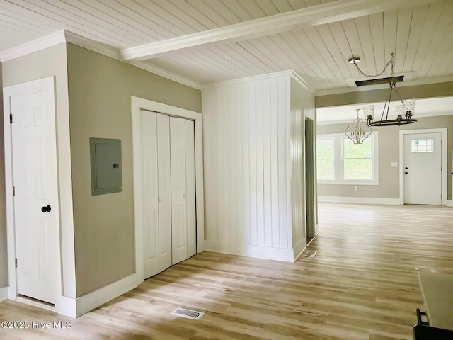 1200 N Center St, Goldsboro, NC 27530 - corridor featuring electric panel, a chandelier, light wood-type flooring, baseboards, and crown molding