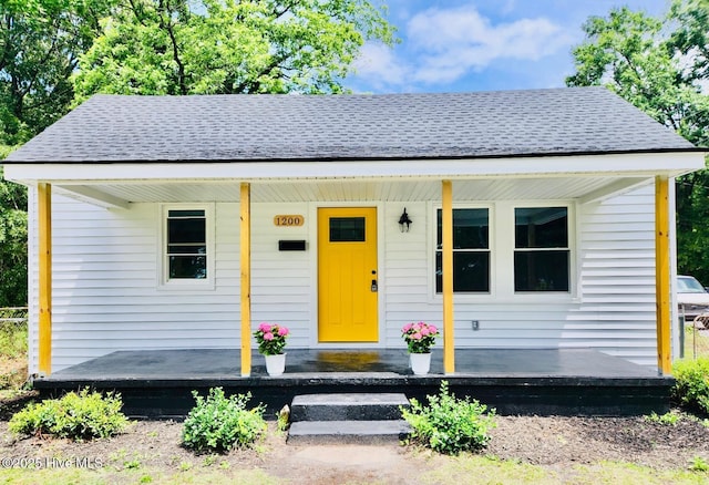 1200 N Center St, Goldsboro, NC 27530 - bungalow-style house with covered porch and a shingled roof