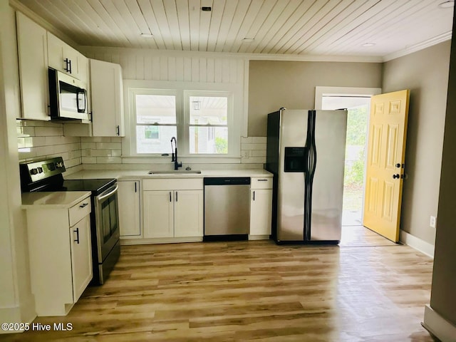 1200 N Center St, Goldsboro, NC 27530 - kitchen with stainless steel appliances, a sink, wooden ceiling, tasteful backsplash, and crown molding