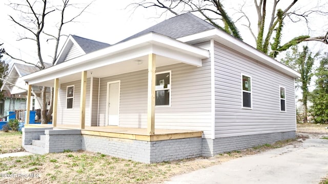 216 S Tillery St, Rocky Mount, NC 27804 - view of side of home with a porch and roof with shingles