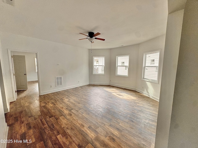 216 S Tillery St, Rocky Mount, NC 27804 - empty room featuring a ceiling fan, wood finished floors, and baseboards