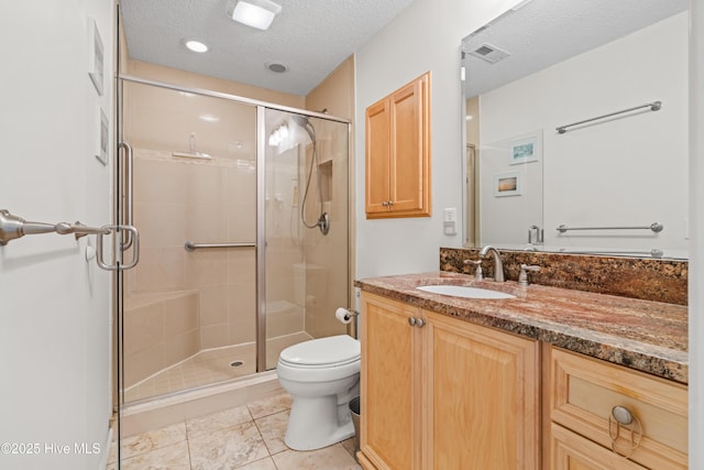 3350 Club Villas Dr # 1403, Southport, NC 28461 - bathroom featuring vanity, toilet, a stall shower, a textured ceiling, and tile patterned floors