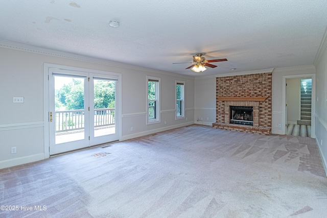 102 Plantation Rd, Goldsboro, NC 27530 - unfurnished living room with crown molding, carpet flooring, a ceiling fan, baseboards, and a textured ceiling