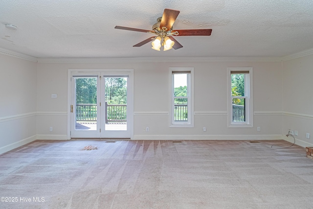 102 Plantation Rd, Goldsboro, NC 27530 - spare room with a textured ceiling, a ceiling fan, carpet floors, baseboards, and crown molding
