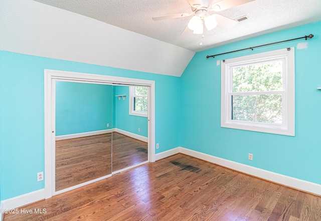 102 Plantation Rd, Goldsboro, NC 27530 - additional living space featuring vaulted ceiling, wood finished floors, a ceiling fan, a textured ceiling, and baseboards