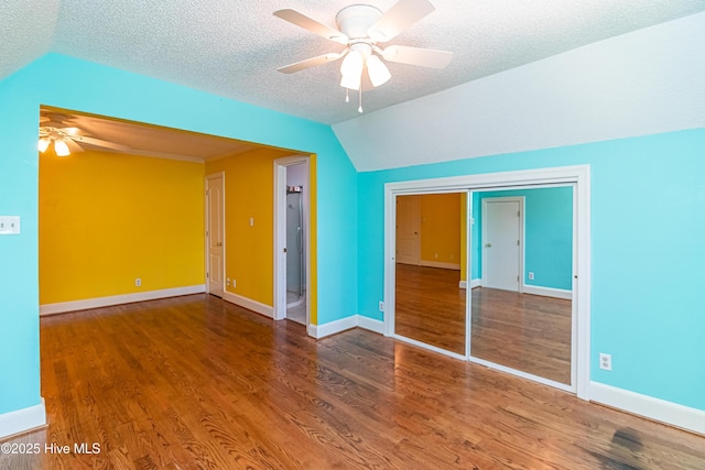 102 Plantation Rd, Goldsboro, NC 27530 - unfurnished bedroom with vaulted ceiling, wood finished floors, baseboards, a textured ceiling, and ceiling fan