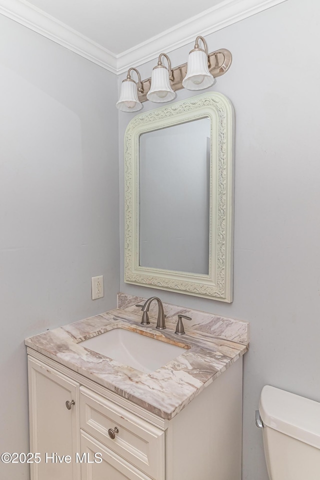 102 Plantation Rd, Goldsboro, NC 27530 - bathroom featuring vanity, toilet, and crown molding