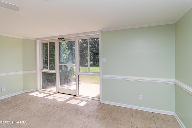 102 Plantation Rd, Goldsboro, NC 27530 - spare room with tile patterned flooring, baseboards, and crown molding