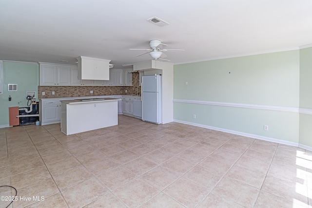 102 Plantation Rd, Goldsboro, NC 27530 - kitchen featuring white appliances, light countertops, a ceiling fan, decorative backsplash, and a sink