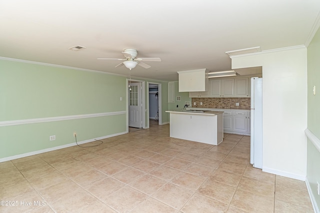 102 Plantation Rd, Goldsboro, NC 27530 - kitchen featuring freestanding refrigerator, light countertops, decorative backsplash, a ceiling fan, and light tile patterned flooring