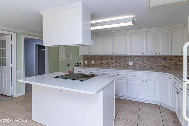 102 Plantation Rd, Goldsboro, NC 27530 - kitchen featuring black electric stovetop, light tile patterned flooring, backsplash, white cabinetry, and ornamental molding