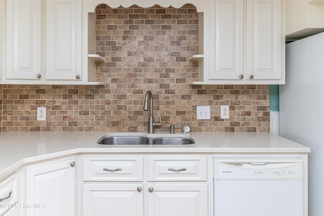 102 Plantation Rd, Goldsboro, NC 27530 - kitchen with dishwasher, a sink, backsplash, and freestanding refrigerator