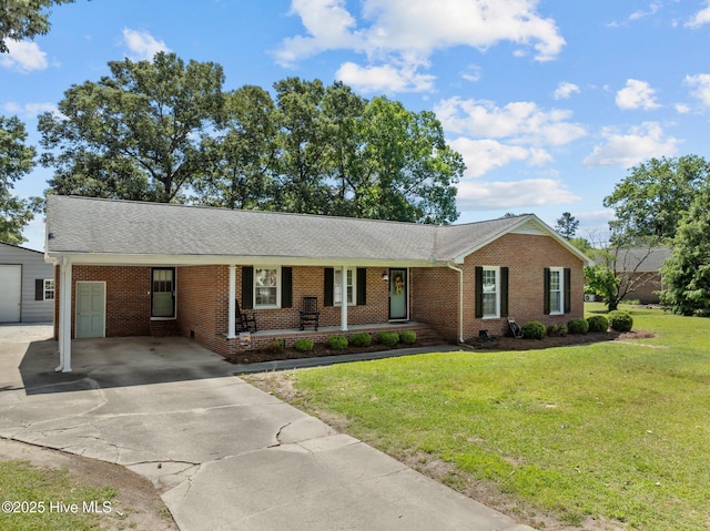 5137 Carr, Grifton, NC 28530 - ranch-style house featuring concrete driveway, a porch, brick siding, a front yard, and roof with shingles
