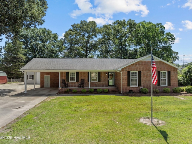 5137 Carr, Grifton, NC 28530 - single story home with driveway, brick siding, a front yard, a carport, and covered porch