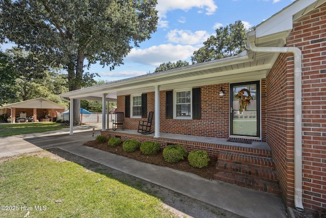 5137 Carr, Grifton, NC 28530 - view of front of house with brick siding, covered porch, and concrete driveway