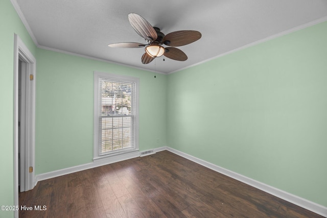5137 Carr, Grifton, NC 28530 - spare room with crown molding, dark wood-style flooring, a ceiling fan, and baseboards