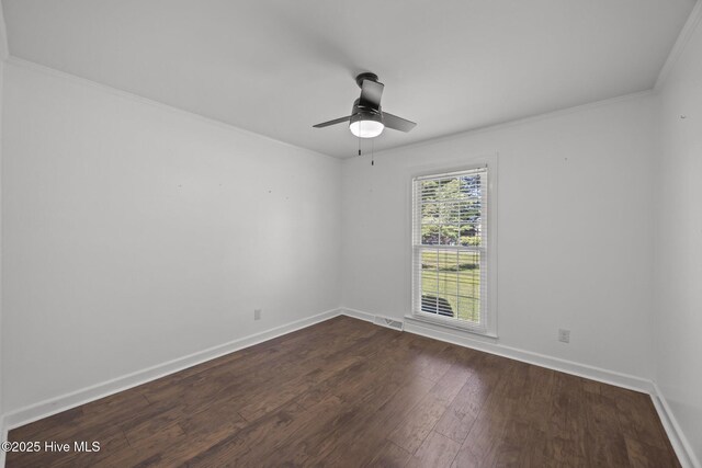 5137 Carr, Grifton, NC 28530 - unfurnished room featuring baseboards, dark wood finished floors, a ceiling fan, and crown molding