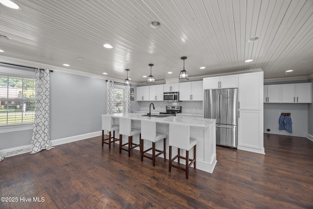 5137 Carr, Grifton, NC 28530 - kitchen with appliances with stainless steel finishes, recessed lighting, wooden ceiling, plenty of natural light, and a center island with sink