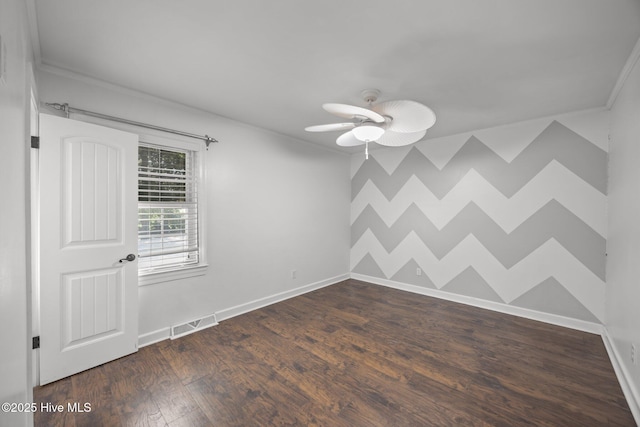 5137 Carr, Grifton, NC 28530 - spare room with baseboards, ceiling fan, ornamental molding, and dark wood-style floors