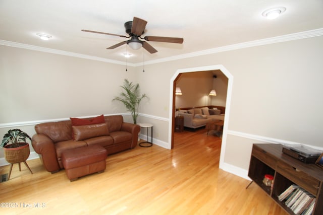 1317 Worthington Ln, Greenville, NC 27858 - living room with a ceiling fan, light wood-style floors, arched walkways, and crown molding