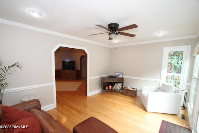 1317 Worthington Ln, Greenville, NC 27858 - living room with ceiling fan, wood finished floors, arched walkways, and crown molding