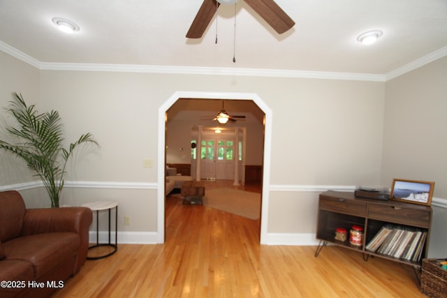 1317 Worthington Ln, Greenville, NC 27858 - sitting room with a ceiling fan, wood finished floors, crown molding, and arched walkways