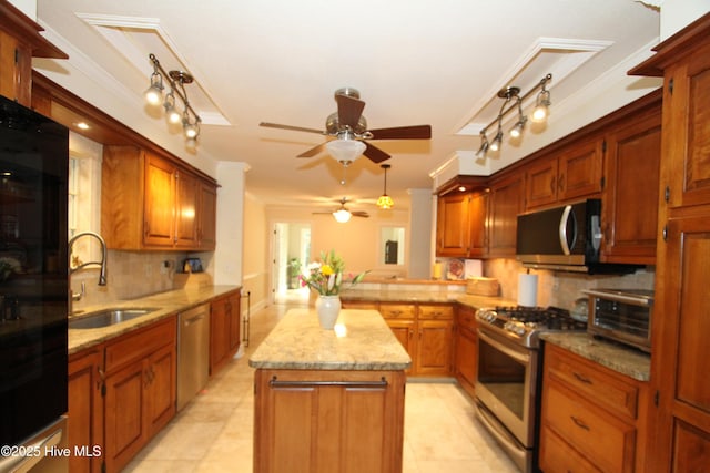 1317 Worthington Ln, Greenville, NC 27858 - kitchen featuring stainless steel appliances, ceiling fan, backsplash, a center island, and ornamental molding