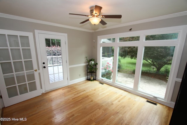 1317 Worthington Ln, Greenville, NC 27858 - doorway to outside with wood finished floors, plenty of natural light, crown molding, and a ceiling fan