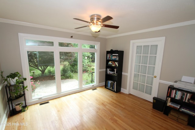 1317 Worthington Ln, Greenville, NC 27858 - living area with wood finished floors, ornamental molding, and ceiling fan