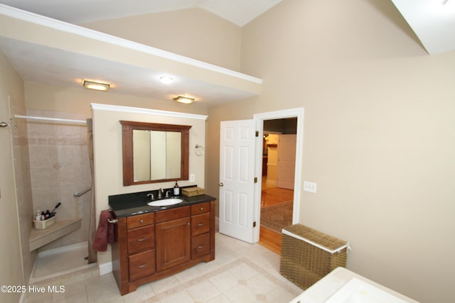 1317 Worthington Ln, Greenville, NC 27858 - bathroom featuring vaulted ceiling, vanity, and tiled shower