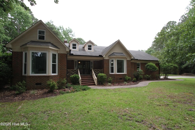 1317 Worthington Ln, Greenville, NC 27858 - view of front of home with crawl space, brick siding, a front yard, and covered porch