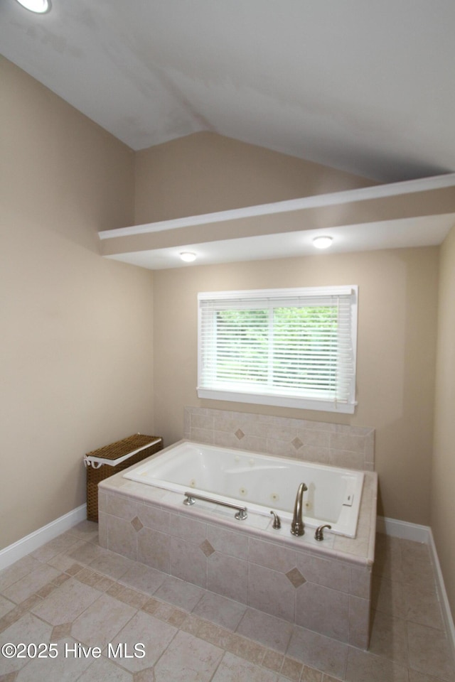 1317 Worthington Ln, Greenville, NC 27858 - bathroom featuring a jetted tub, tile patterned floors, and lofted ceiling