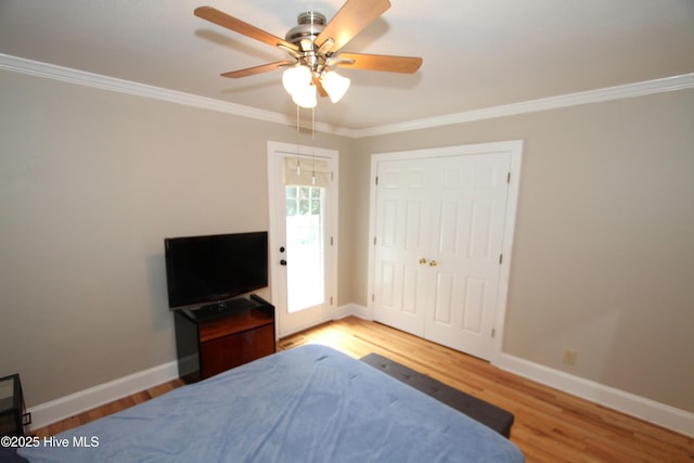 1317 Worthington Ln, Greenville, NC 27858 - bedroom with wood finished floors, crown molding, and ceiling fan