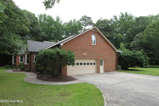 1317 Worthington Ln, Greenville, NC 27858 - view of front of property with brick siding, an attached garage, concrete driveway, and a front lawn