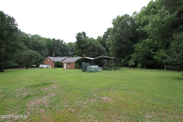 1317 Worthington Ln, Greenville, NC 27858 - view of green lawn featuring a carport
